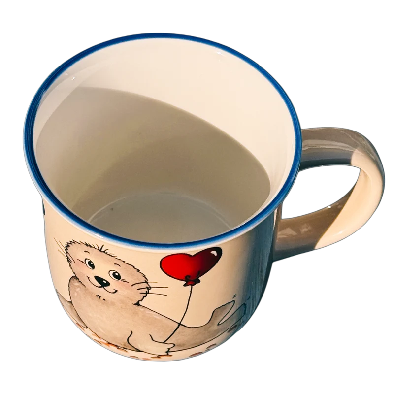 Tasse, Namenstasse „Robbe mit Herzluftballon“ mit Wunschnamen 2.0 - Jeder Name ist möglich!