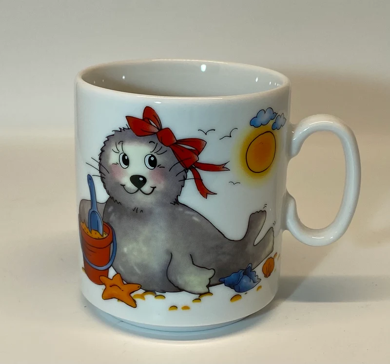 Tasse, Porzellan, Robbe „Mädchen“ mit Wunschnamen - Jeder Name ist möglich!