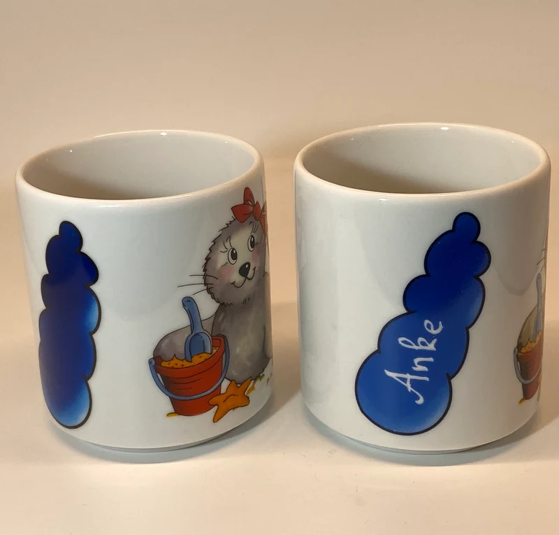 Tasse, Porzellan, Robbe „Mädchen“ mit Wunschnamen - Jeder Name ist möglich!