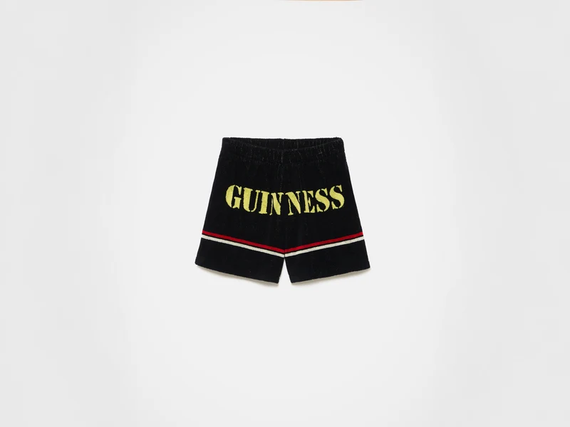 Unisex JW ANDERSON X GUINNESS TOWELLING SHORTS IN BLACK