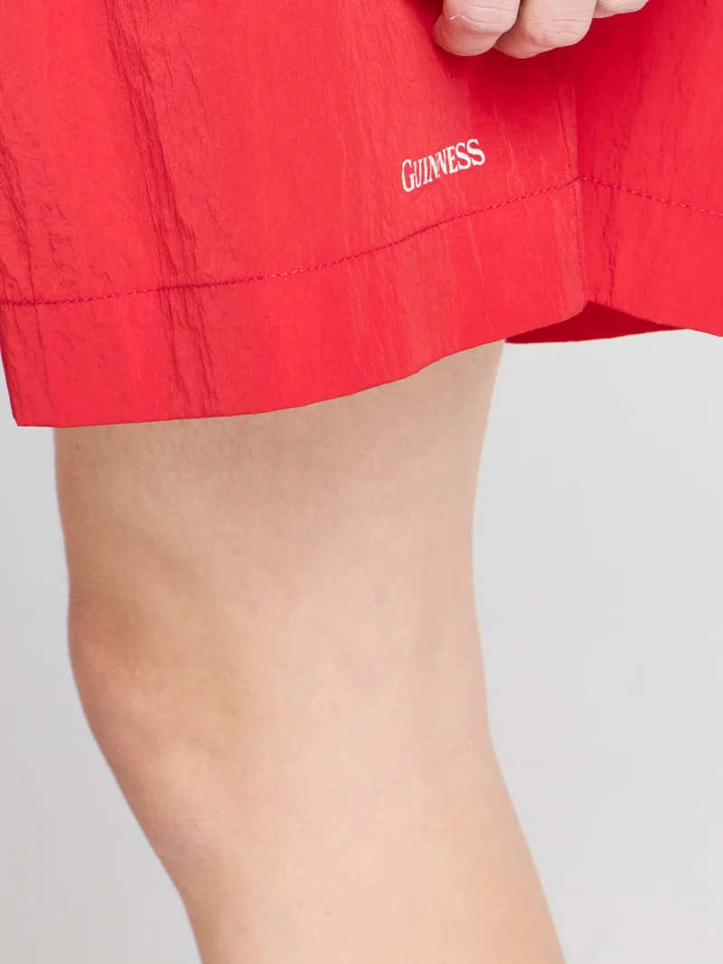Unisex JW ANDERSON X GUINNESS SLOGAN TRACK SHORTS IN RED
