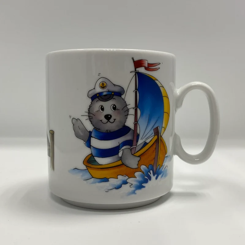 Tasse, Porzellan, Robbe „Segler, Seefahrer - Steg“ mit Wunschnamen - Jeder Name ist möglich!