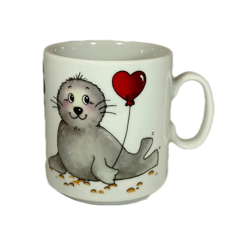 Tasse, Porzellan, „Robbe Herzluftballon“ mit Wunschnamen - Jeder Name ist möglich!