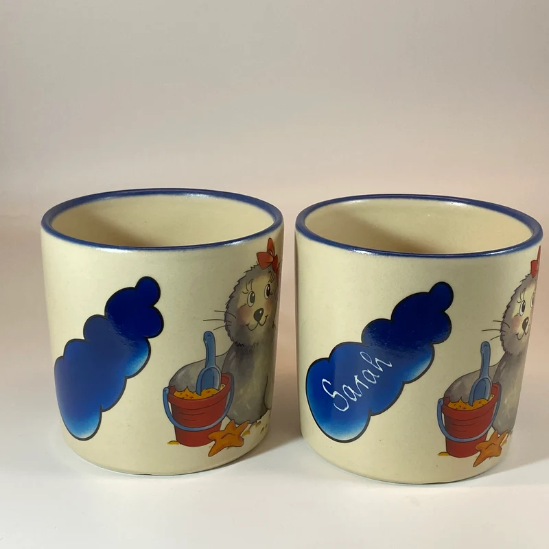 Tasse, Keramik, Robbe „Mädchen“ mit Wunschnamen - Jeder Name ist möglich!