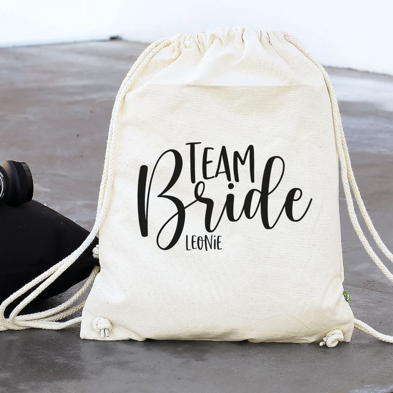 JGA Baumwoll-Rucksack mit Wunschname | Team Bride | Schwarz & Natur